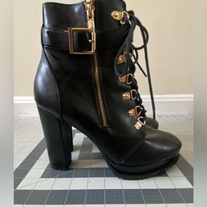 Black heeled lace-up combat boots, gold buckle Shoedazzle